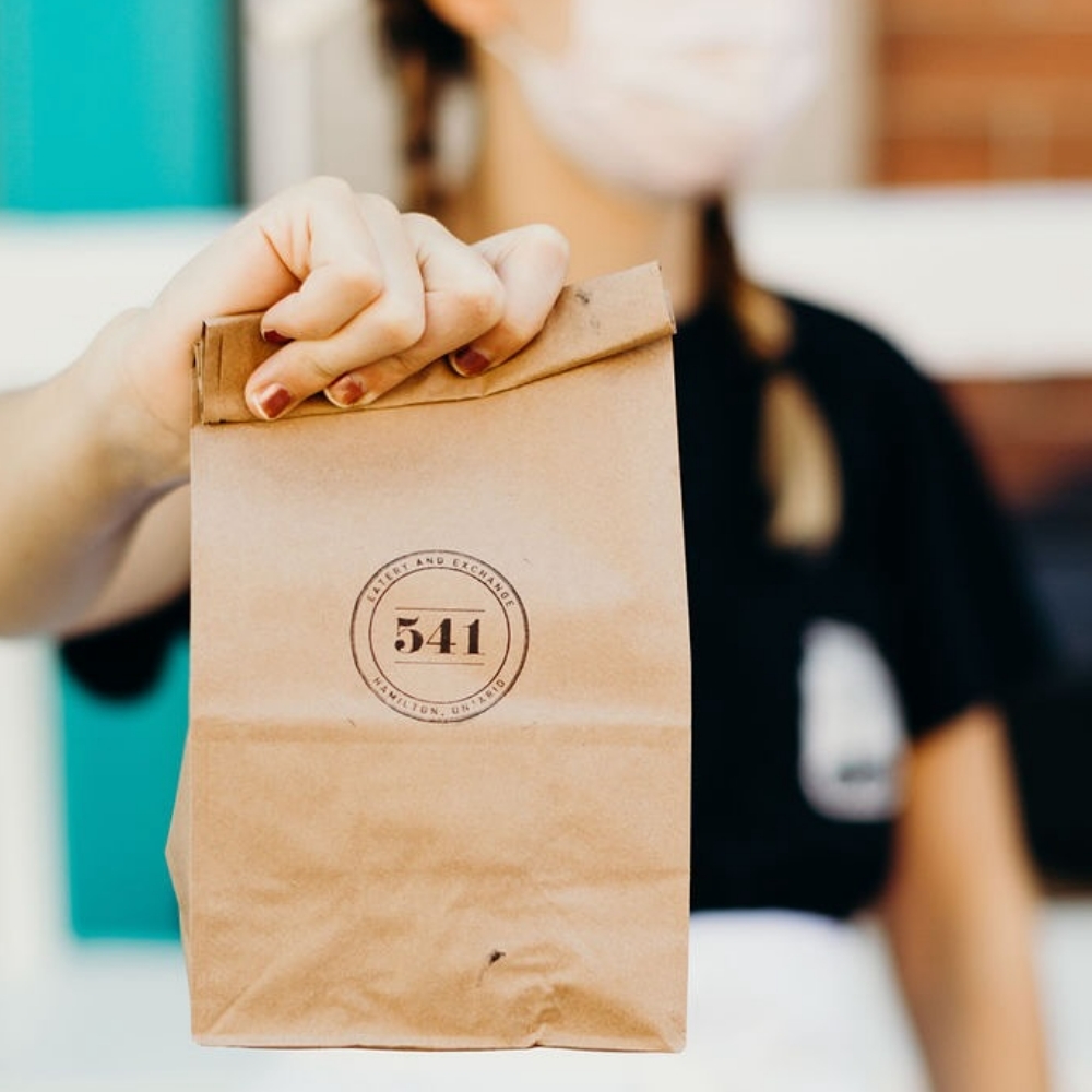 Brown paper bag with the 541 Eatery & Exchange logo. 541 Eatery & Exchange. 2024 Grand Prize Winner.