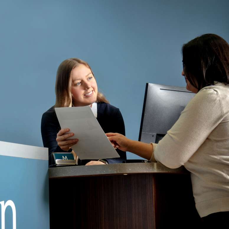 Meridian advisor looking at paperwork with a Member