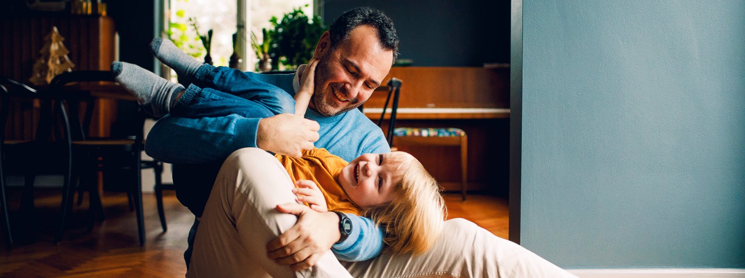 Father and child playing