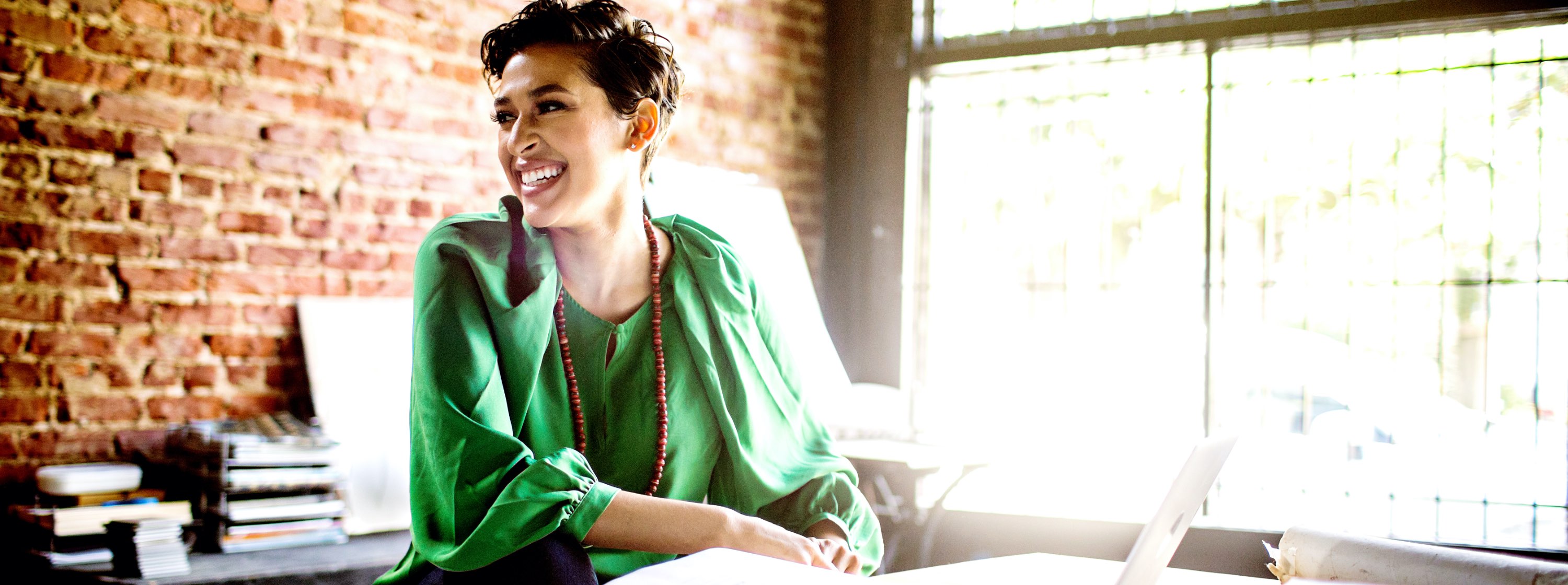 Confident women smiling while working