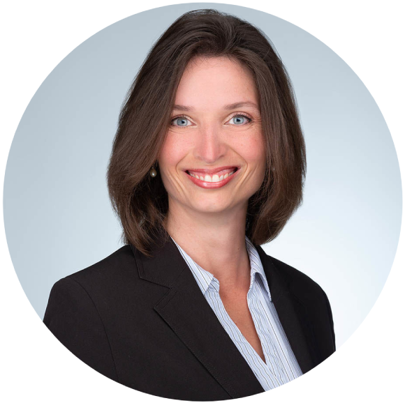 Light skinned female advisor with shoulder length brown hair wearing professional attire.