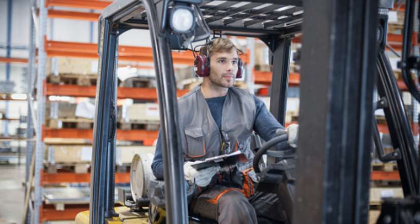 Man driving forklift