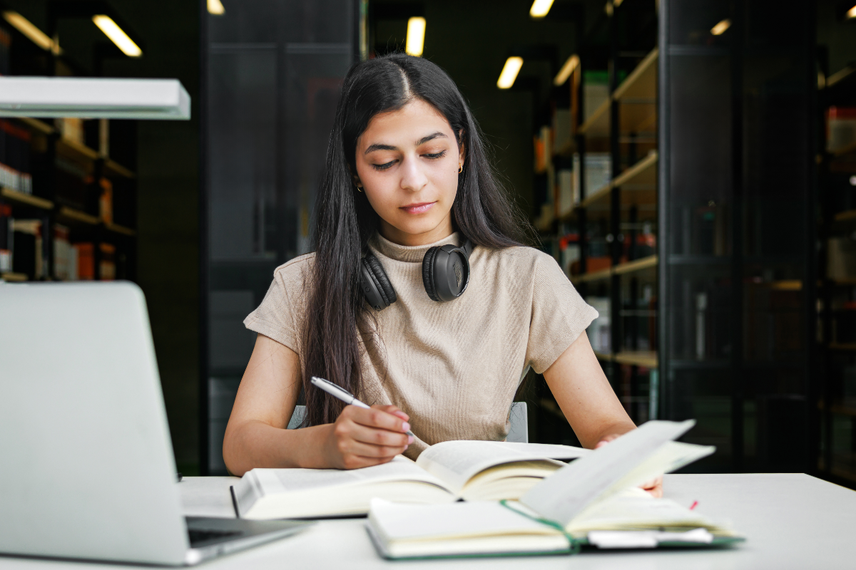 young female student studying in college