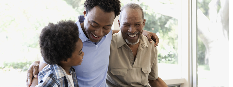 Smiling father, son and grandfather