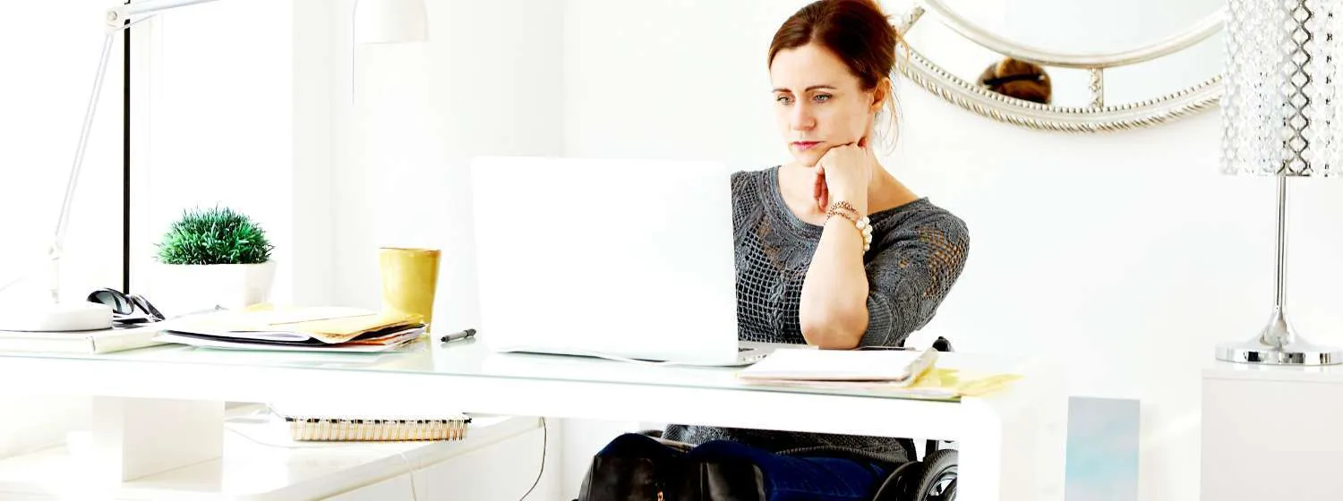 Woman looking at her laptop