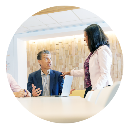 Diverse Meridian employees in a conference room