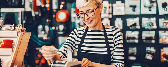 Woman pulling a receipt out of a hand-held register