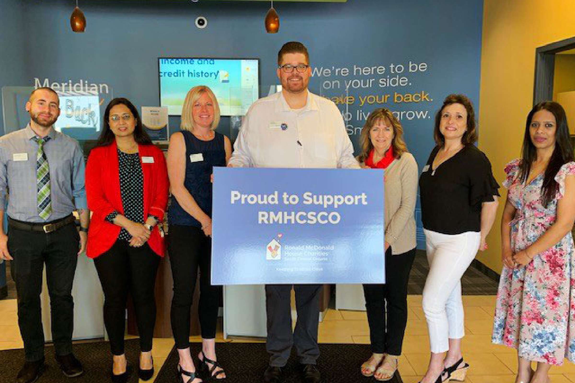 Meridian branch staff with Ronald McDonald House Charities team standing together at Meridian branch