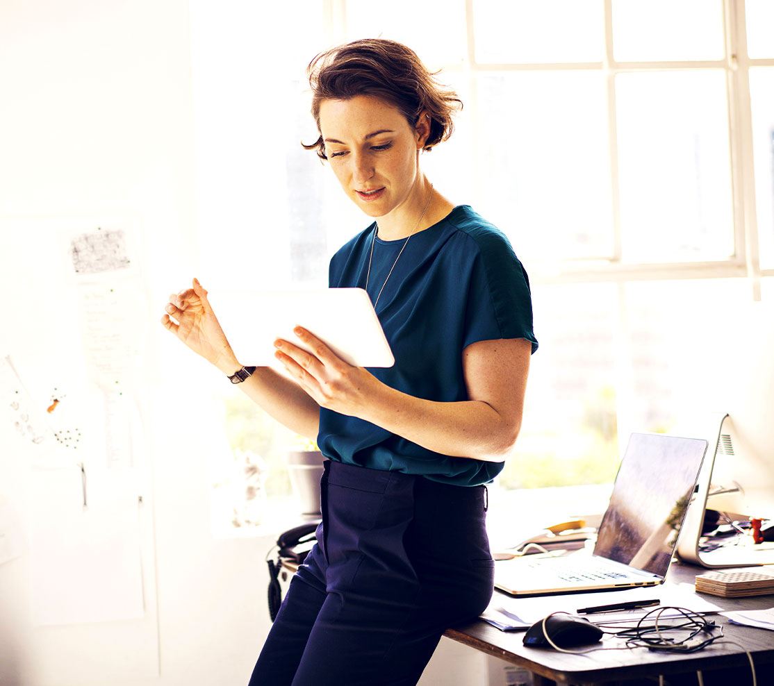 A business woman works on her tablet