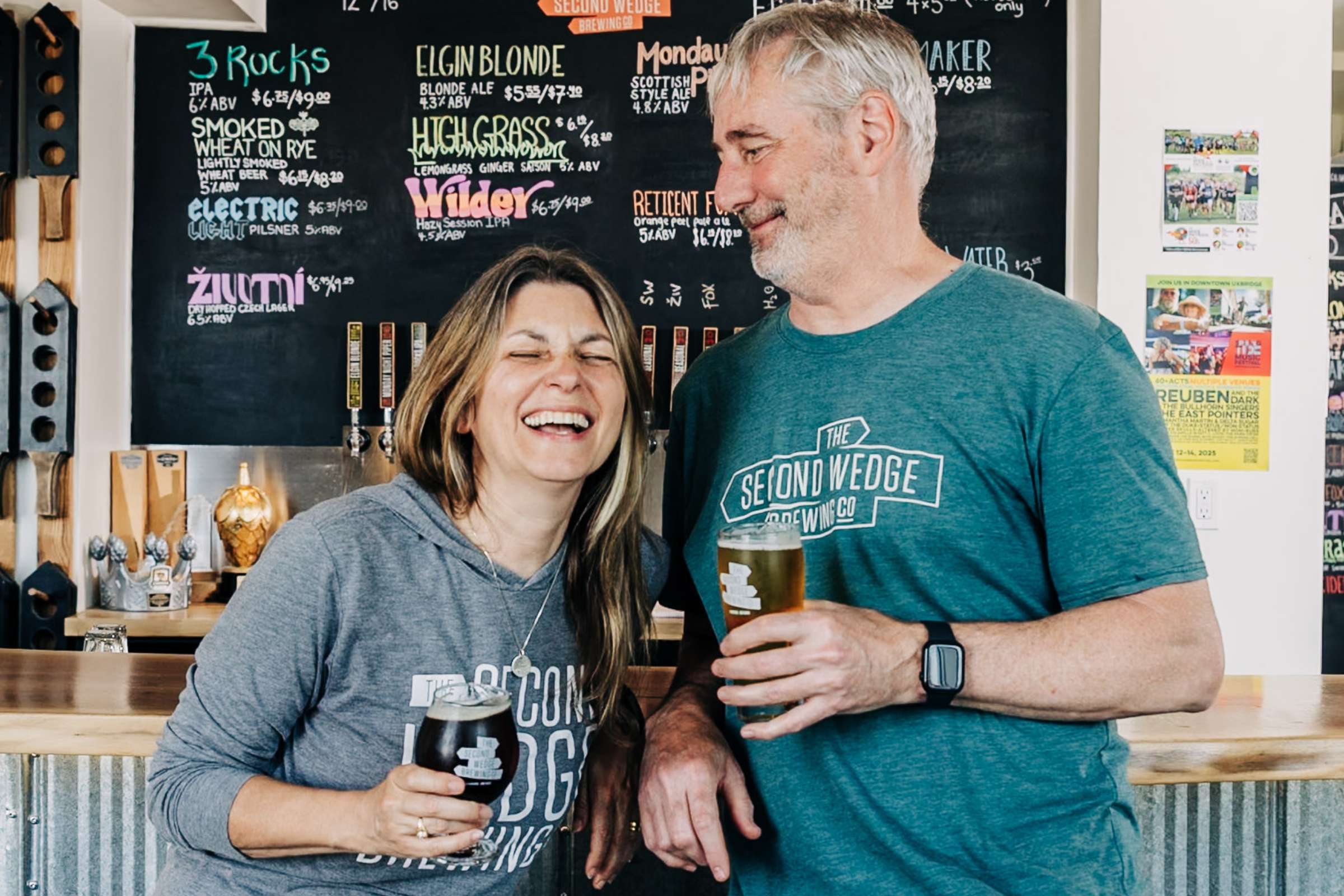 Couple who are founders of The Second Wedge smile happily in the photo