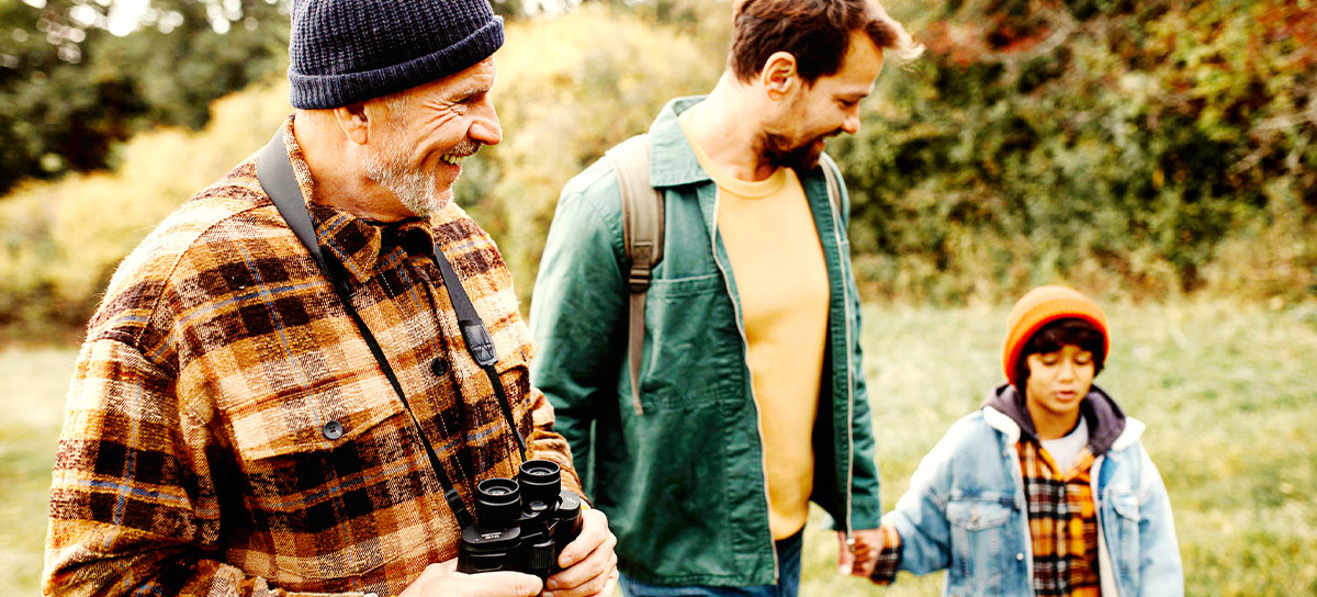 Three generations; a father, his son, and his grandson out for a hike