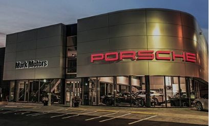 an exterior view of the Mark Motors Porsche dealership