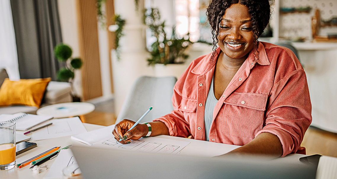 Woman sitting at a desk, working on documents