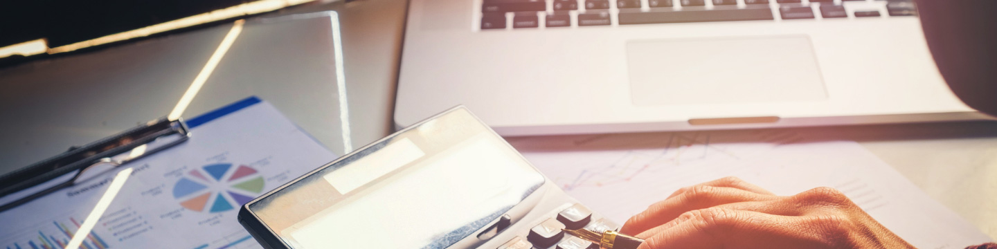 Close up of hand using a calculator