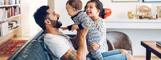 Family with baby on a couch